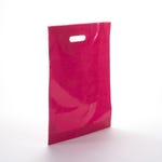 Plastic tas met uitgesneden handvatten fuchsia - per 100